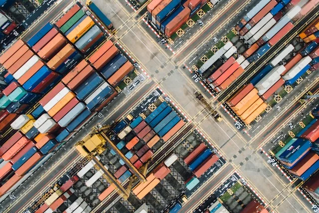 Aerial view of a busy shipping container terminal.